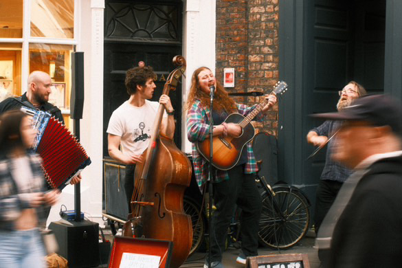 Hyde Family Jam busking on a York street with accordion, double bass, guitar and fiddle